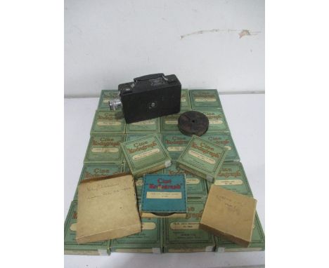 A Cine Kodak camera model B-B with a collection of boxed and loose 16mm film