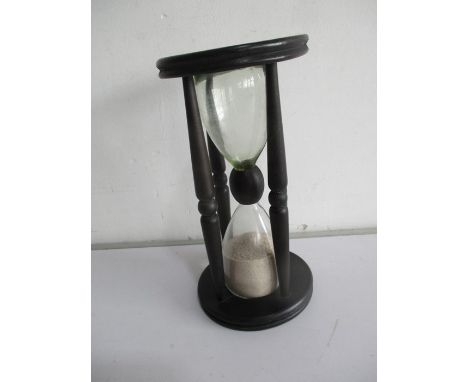 A vintage wooden egg timer