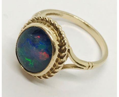 A 9ct gold ring set with an opal