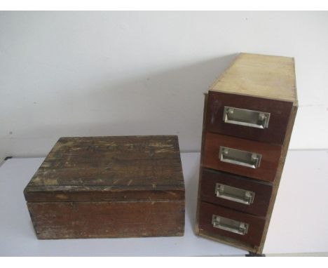 A collection of vintage loose Meccano including spare parts and accessories, stored in a wooden box and a set of four drawers
