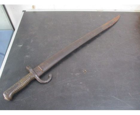 A French Chassepot bayonet, the blade inscribed Etienne Fevrier 1873 in mismatched serial numbers scabbard 