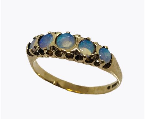 An opal five stone ring set in 9ct gold, size O