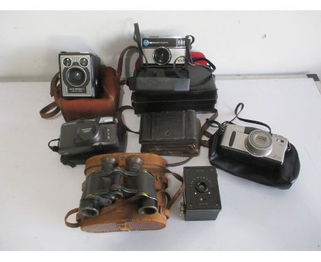 A small collection of camera's including Kodak Six-20 "Brownie" E, Canon, Olympus, along with a vintage pair of Ross binocula