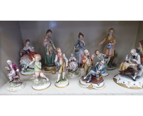 Ceramic figures: to include a Naples china example, a man seated at a table reading a book  8''h      OS2