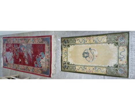 Two similar Chinese wash rugs, decorated in traditional taste  24'' x 38'' &amp; 30'' x 60''       CA