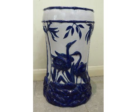 A 20thC (possibly European) ceramic pedestal seat, decorated in blue and white with herons and foliage  21''h       SR