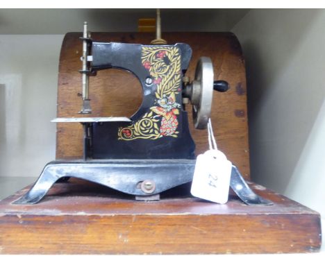 An early 20thC 'Little Betty' manual sewing machine  cased       OS2