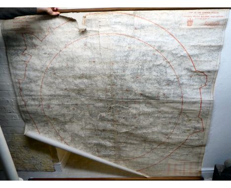 A printed paper, linen backed, rolled wall map, featuring Central London and Suburbs, as administered by The London Master Bu