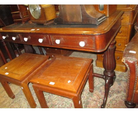 19th Century mahogany writing table with a simulated black leather top above three frieze drawers with white ceramic knob han