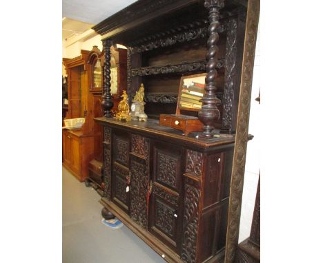 19th Century Continental carved oak buffet, the canopy top with a boarded shelf back and baluster turned upright supports, th