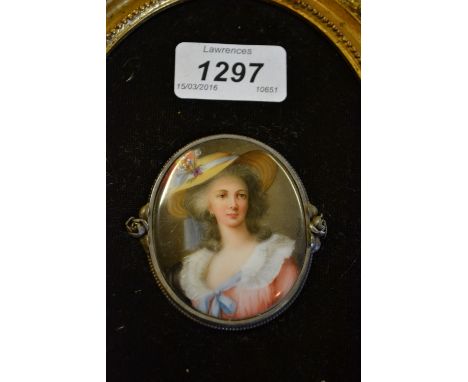 Miniature portrait in enamels on porcelain of a lady wearing a straw bonnet, white metal mounted and gilt framed