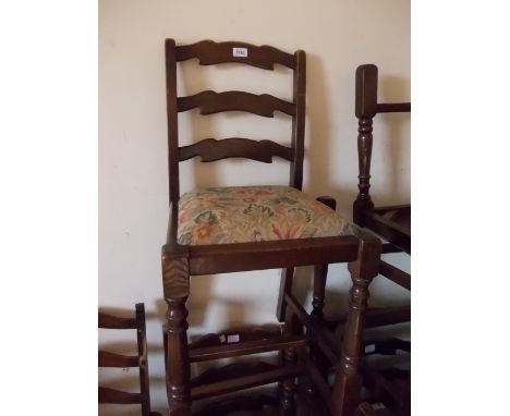 Set of six (four plus two) oak ladder back dining chairs on turned supports