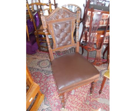Set of four late Victorian carved oak and button upholstered dining room chairs