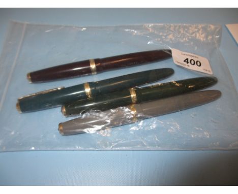 Bag containing four various vintage Parker fountain pens