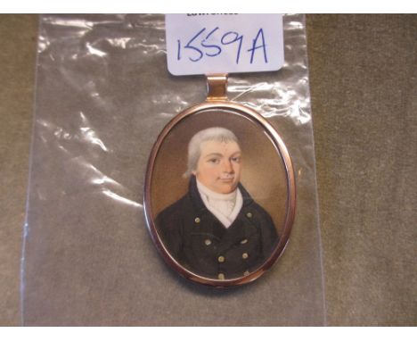 18th / 19th Century watercolour portrait miniature of a gentleman, in gilt metal pendant mount with blue glass back