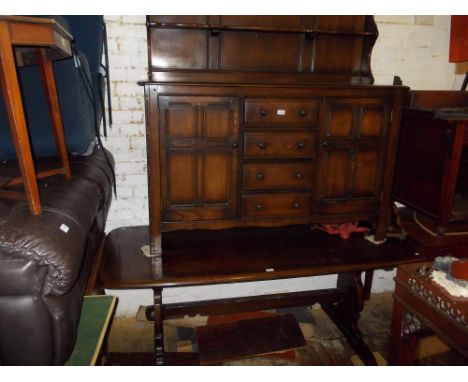 Mid 20th Century Ercol dining room suite comprising: refectory style table, six chairs and a dresser with boarded shelf back