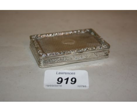 Good quality early 19th Century white metal rectangular snuff box with floral cast decorated rim and side, with engine turned