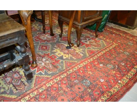 Mid 20th Century Afghan Beshir style carpet with multiple geometric medallions on a fawn ground with multiple borders, 10ft x