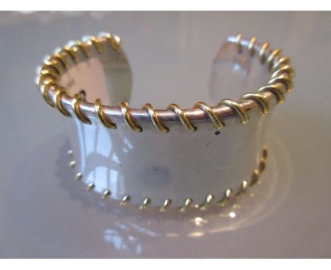 Tiffany & Company silver bangle with yellow gold wirework decoration