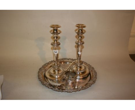 Pair of plated on copper candlesticks, circular plated tray, a post horn, ladle, candle snuffers and a jug