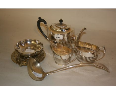 Silver plated three piece tea service together with two plated dishes, a hot plate stand and silver plated ladle