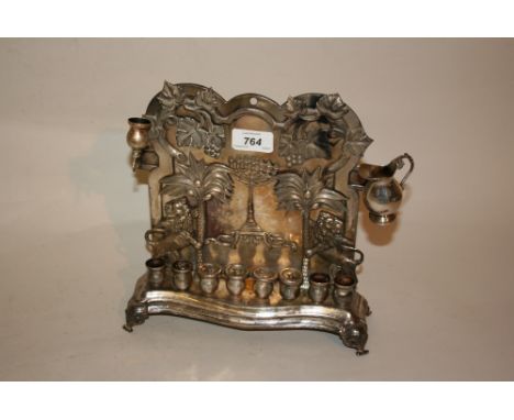 Polish silver plated hanukkah oil lamp decorated in high relief with lions, trees, grape vines and central minora, with maker