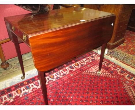 George III mahogany drop-leaf Pembroke table with a single end drawer, raised on square tapering supports with brass and cera