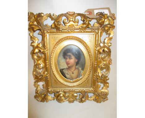 19th Century K.P.M. type porcelain plaque painted with a portrait in a Florentine style carved and gilded frame, the plaque 5