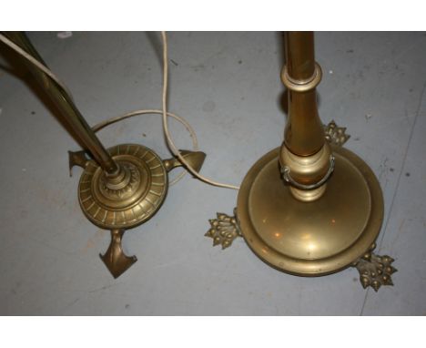 Edwardian brass lamp standard with paw feet and opaque glass shade adapted for use with electricity together with another sim