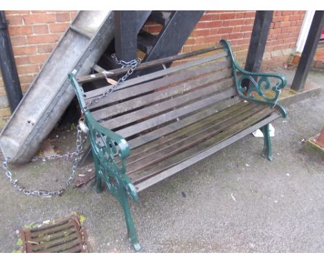 Green painted cast iron and wooden slatted garden bench