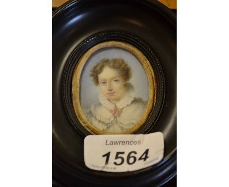 19th Century oval head and shoulder portrait miniature on ivory of a young girl in a ruff collar with pink bow in an ebonised