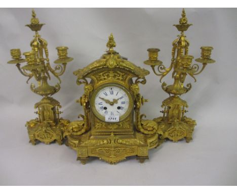 19th Century ormolu three piece clock garniture, the clock with circular enamel dial having Roman numerals and two train move