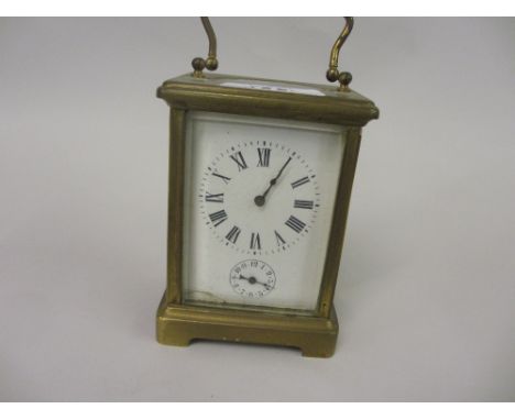 Small 20th Century brass cased carriage clock, the enamel dial (a/f) having Roman numerals and subsidiary alarm dial striking