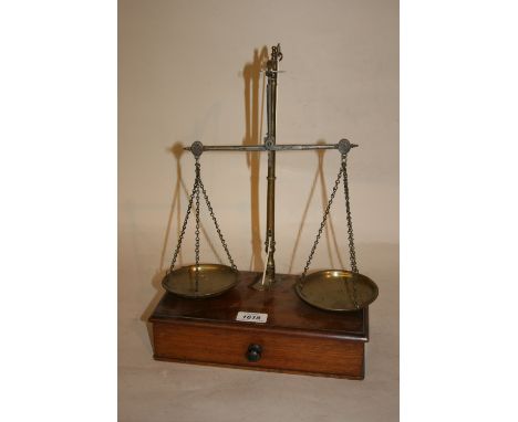 Pair of 19th Century brass balance scales on a single drawer box base together with a small set of bucket weights and other m