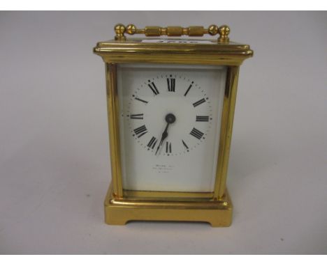 Small brass cased carriage clock, the enamel dial with Roman numerals, signed Walte, London