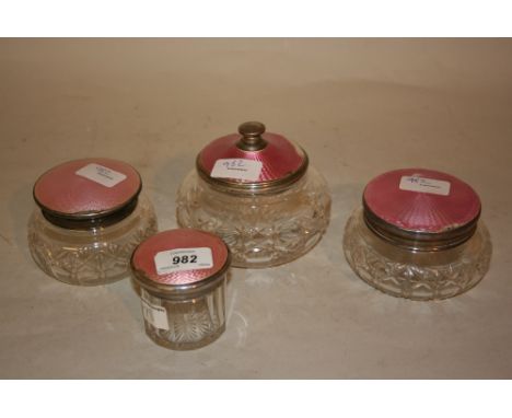 Group of four silver and pink enamel mounted dressing table bottles (a/f)