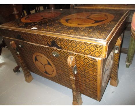 Unusual late 19th Century Japanese lacquer trunk decorated with stylised circular foliate designs on a black and gilt ground 