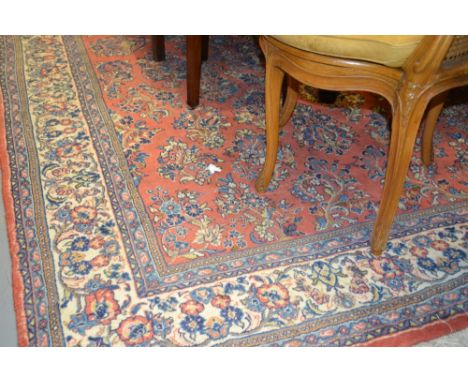 Modern Saruq carpet having all-over floral design on a pink and blue ground with multiple borders, 6ft x 10ft