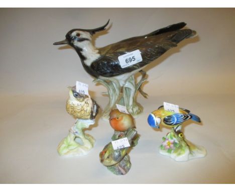 Large Goebel figure of a bird and four various smaller Royal Worcester figures of birds