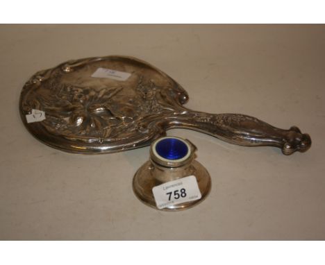 Circular capstan inkwell with blue and cream enamel decorated cover, together with a floral embossed hand mirror (a/f)