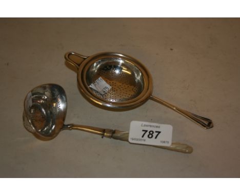 800 mark and mother of pearl ladle, together with a Sheffield silver tea strainer