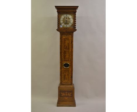 Walnut crossbanded and marquetry inlaid longcase clock, the square hood flanked by three quarter spiral twist columns above a