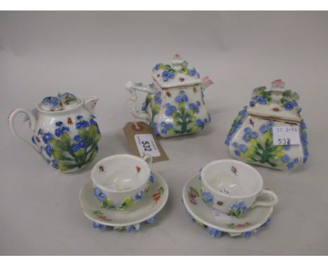 Rosenthal miniature floral encrusted eight piece teaset comprising: teapot, cream jug with lid, sugar bowl and two cups with 