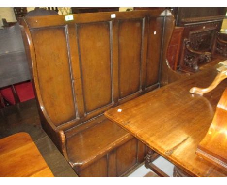 19th / 20th Century stained pine settle with a four panel back above a bench seat