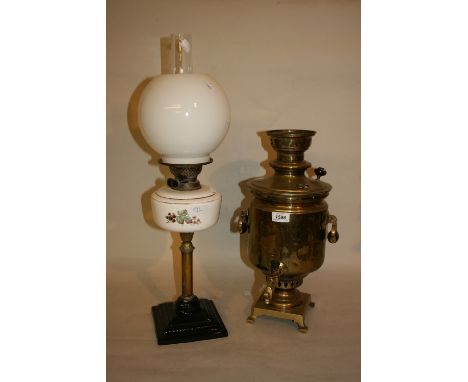 Brass samovar together with a brass and pottery oil lamp with an opaque white glass shade