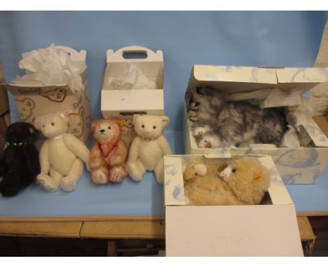 Boxed Steiff figure of a cat with certificate, together with a modern Steiff figure of a bear with certificate, two Steiff ar