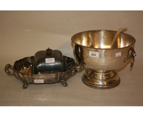 Circular silver plated on copper pedestal punch bowl with ladle together with a plated muffin dish and cover and a plated two