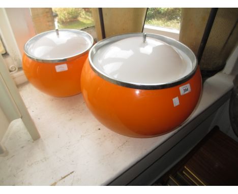 Two 20th Century orange opaque and chrome mounted globe shaped hanging light shades