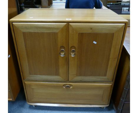 Ercol TV Cabinet: Mid-Century Ercol Honey Elm TV cabinet with hide away doors 