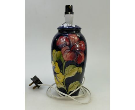 Moorcroft lamp: Moorcroft lamp, hibiscus on blue ground pattern. Crazing to top section. Height approx 35cm 